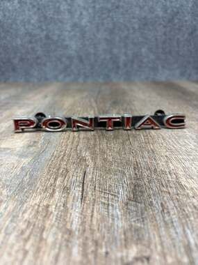OEM 1970-71 PONTIAC LEMANS/TEMPEST ORIGINAL GRILL EMBLEM #477741 color red